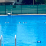 Vibrant split-scene illustration showing a modern swimming pool with glowing blue lane dividers, depth markers, and directional arrows guiding swimmers, contrasted with a lush forest trail marked by colorful blazes on trees and stacked stone cairns for hikers.