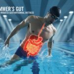 Swimmer in swimsuit sitting by poolside holding stomach due to bloating and cramps after swimming session