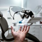 dental clinic scene dentist screening young swimmer gums pre-season, periodontal probe in mouth, healthy pink gums vs red inflamed gums, 70% systemic inflammation text, swimming goggles and trophies in background, shoulder pain prevention